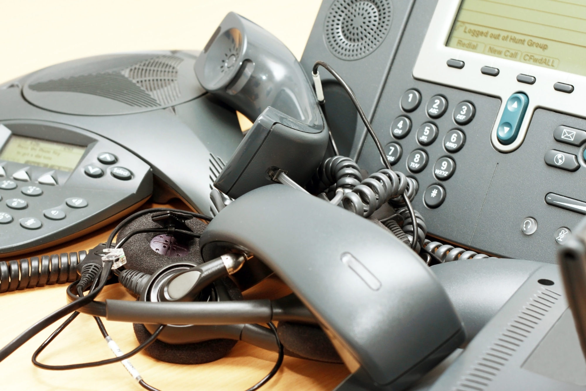 Office voip phones on desk background.